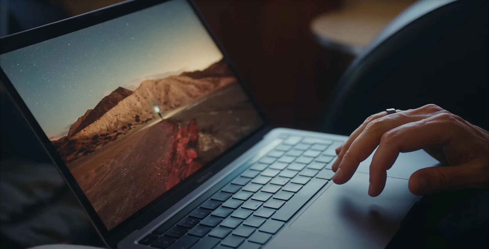 A high-end laptop displaying atmospheric imagery, representing the first moment of visual impact
