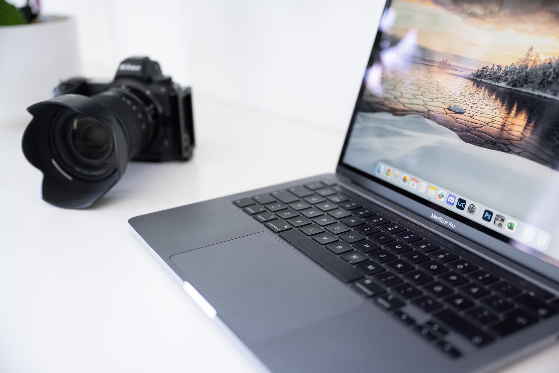 A professional working environment displaying large format atmospheric photography in practice