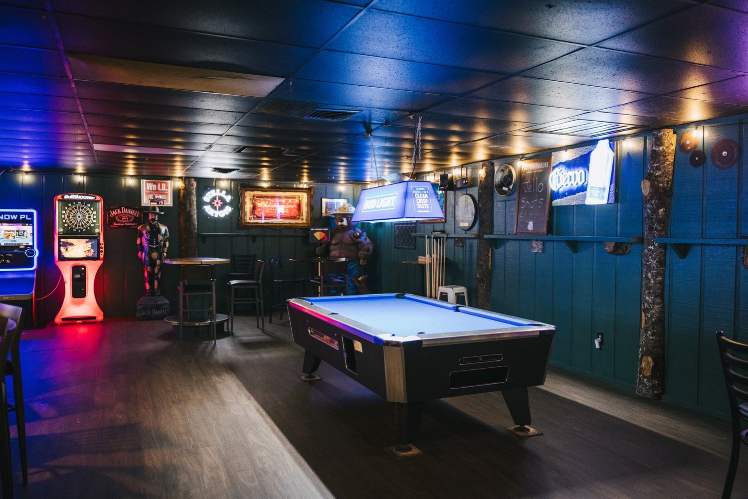 Pool table, dart board and arcade games inside The Sawmill lumberjack bar in Tampa