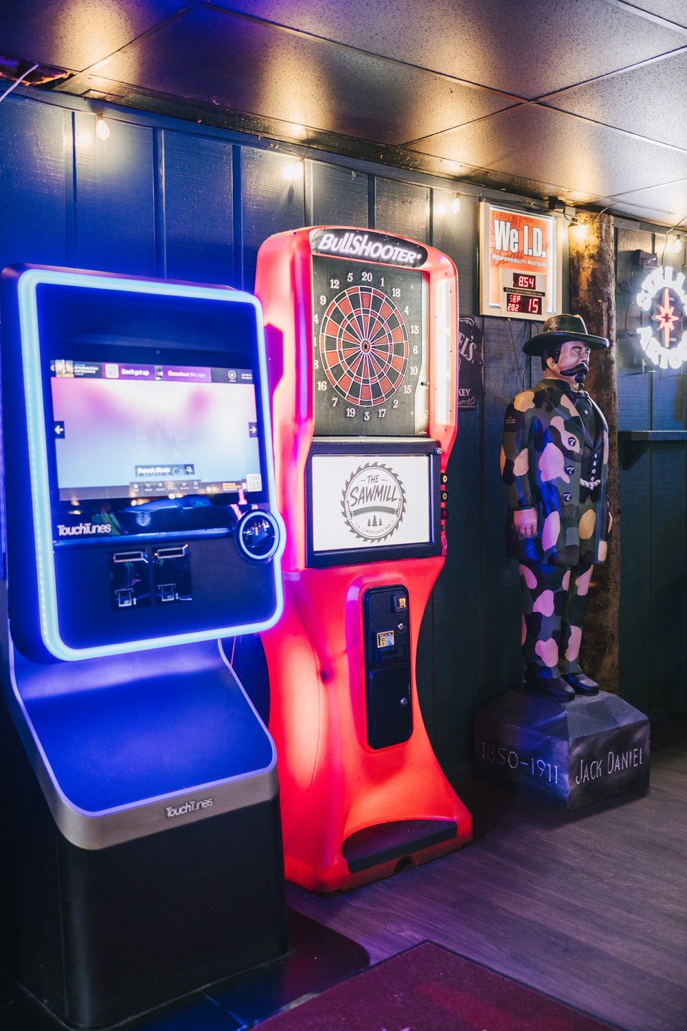 TouchTunes jukebox and electronic dart board at The Sawmill in Tampa