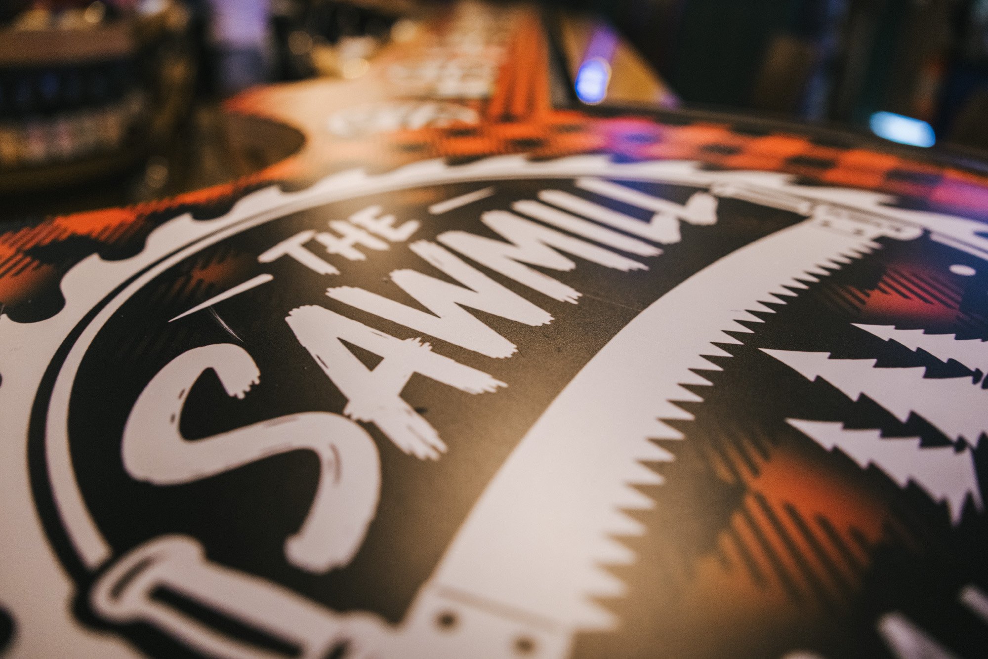 The Sawmill lumberjack bar logo on the buffalo plaid bar front in Tampa
