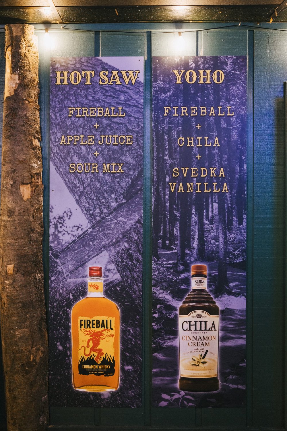 Hot Saw and Yoho signature drink menu boards at The Sawmill in Tampa