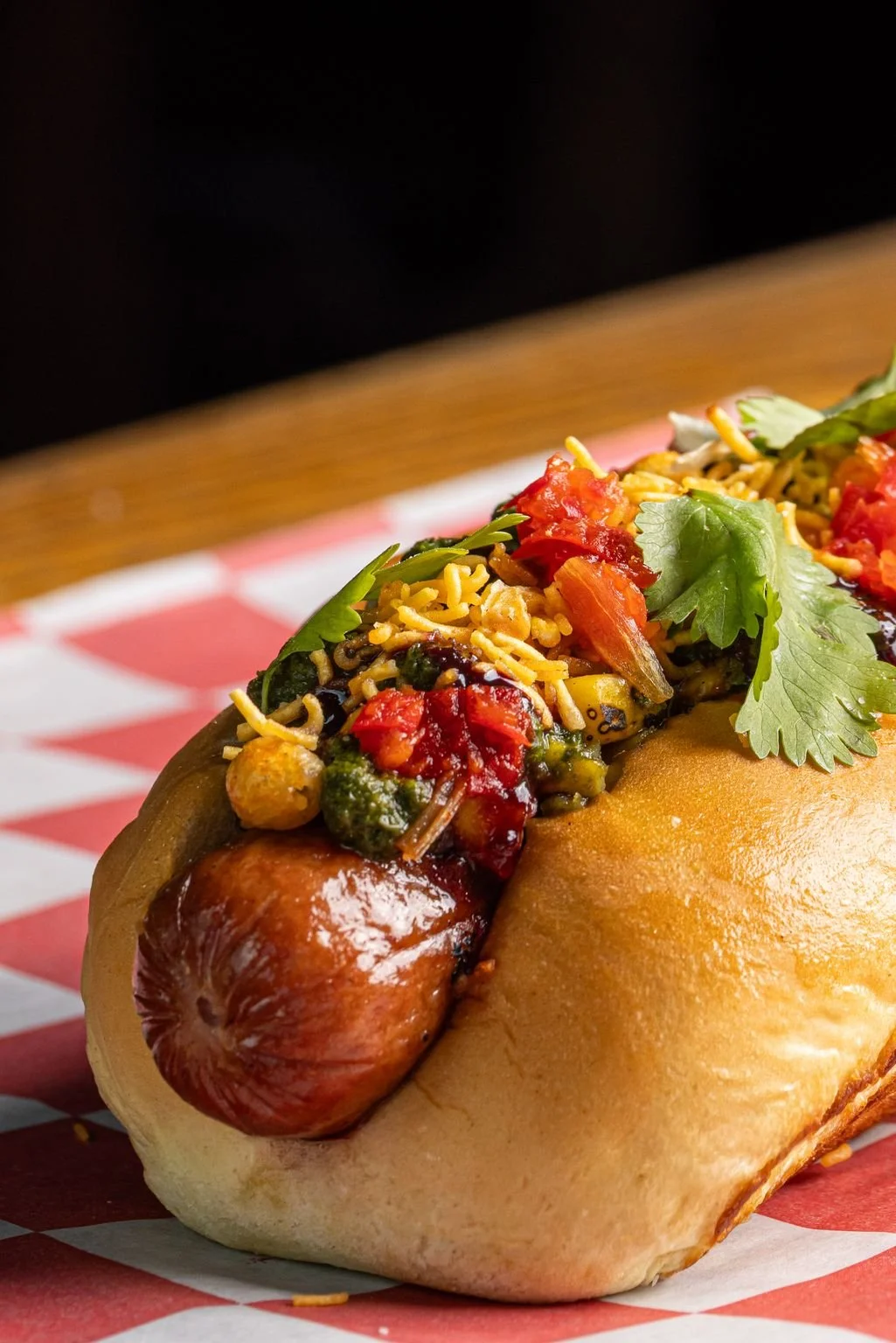 Chaat Dog with corn and poblano chaat