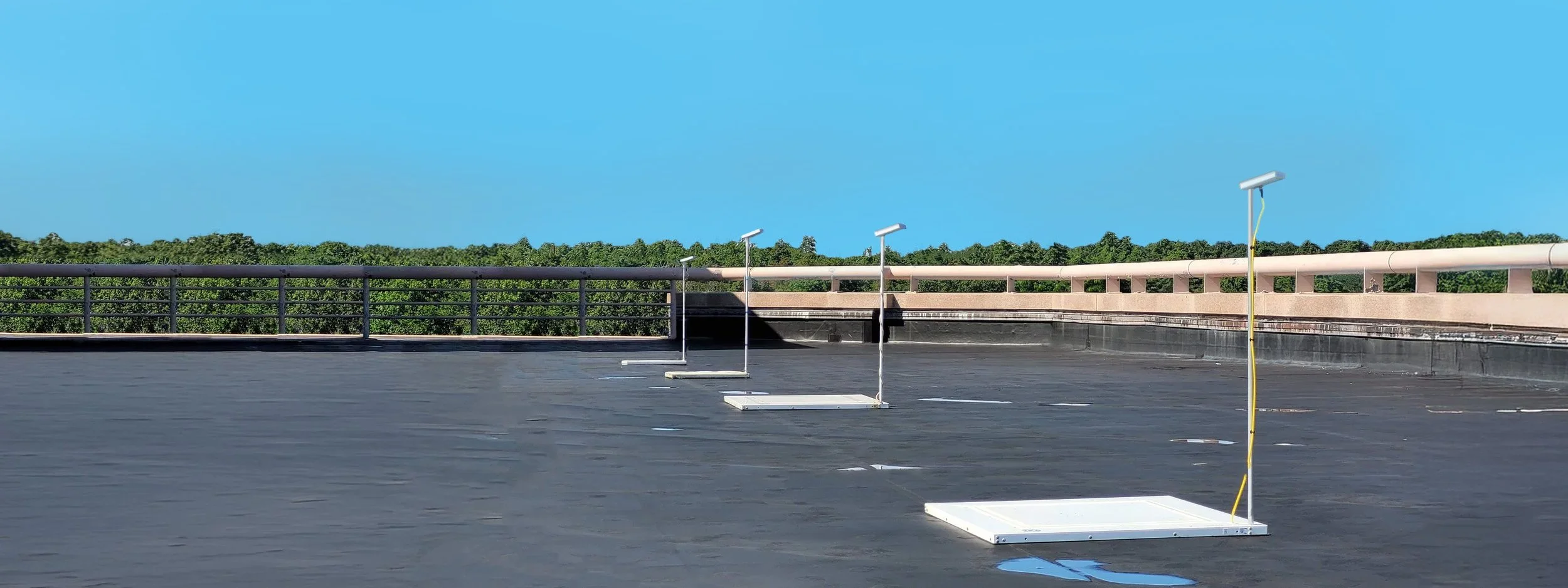 Commercial rooftop with SnowSentry monitoring stations deployed