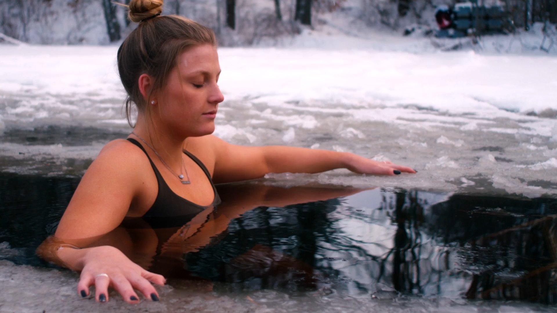 Woman cold bath in ice water