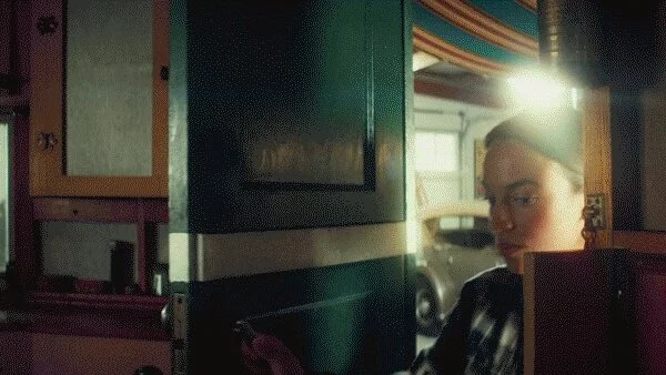 person walking through a door