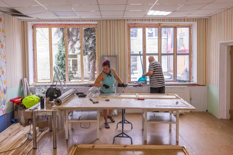 An Insulate Ukraine emergency replacement window being produced for a school in Zaporizhzhia using a wooden frame and transparent PET.