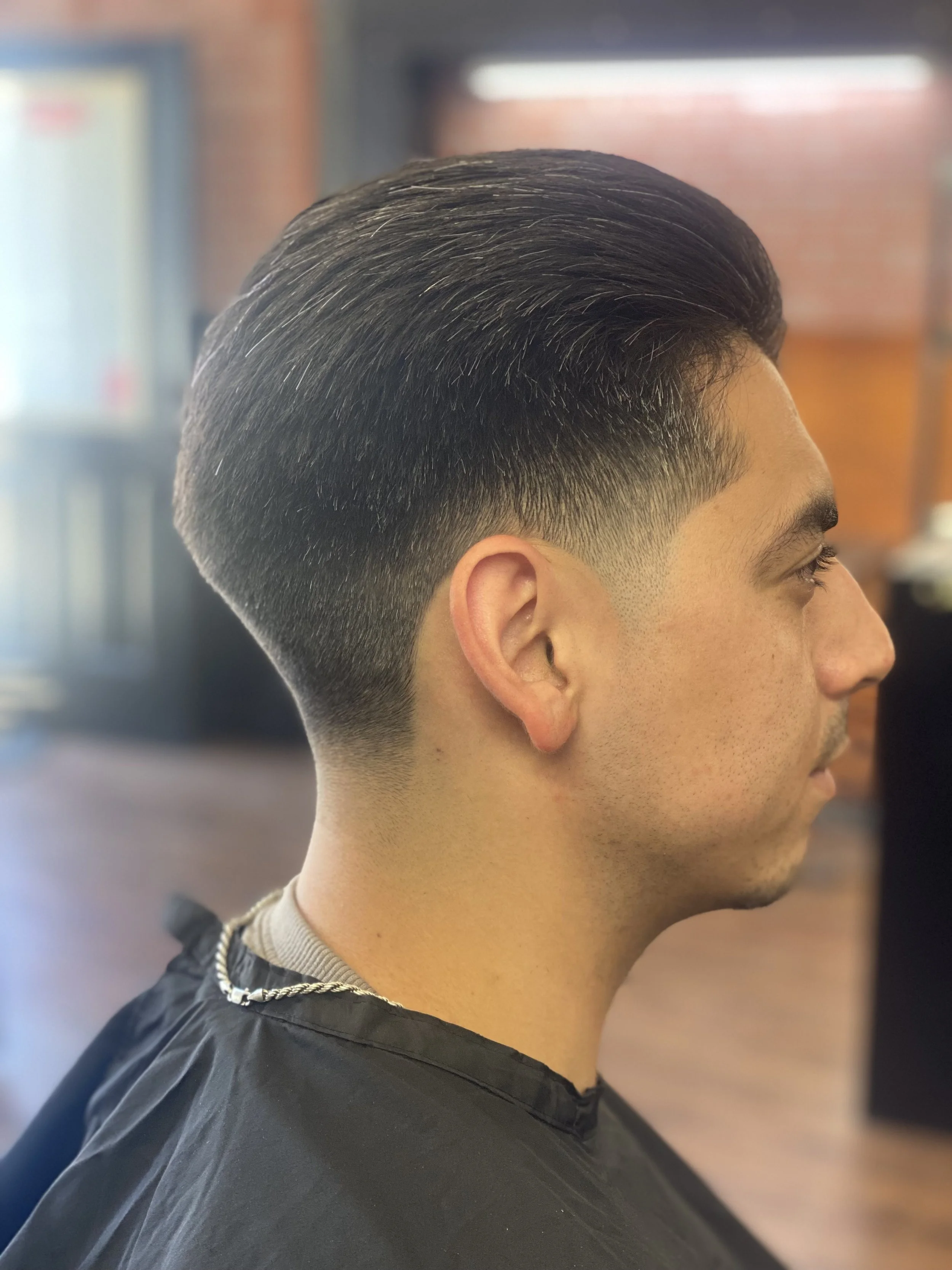 Clean fade haircut side view