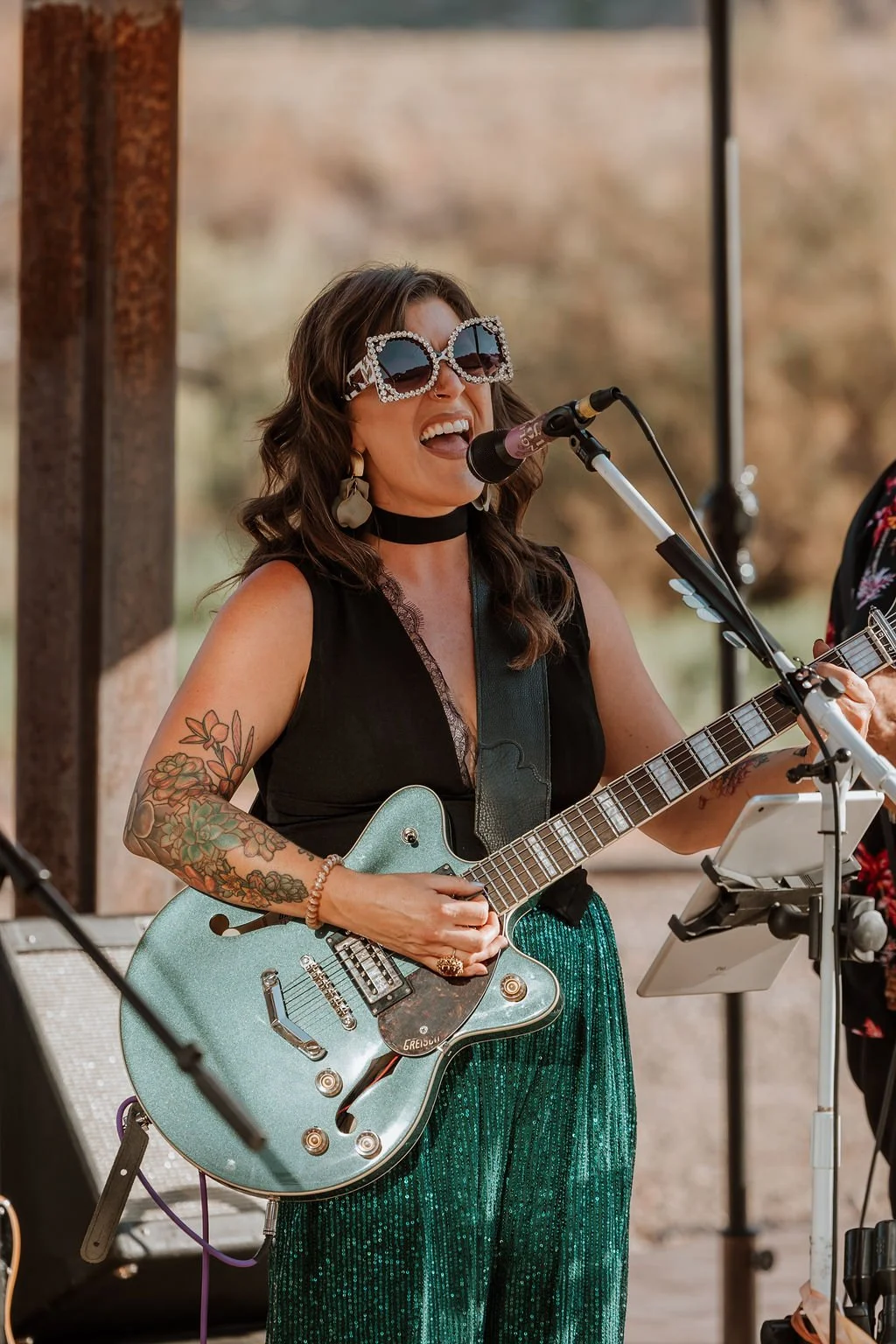 Toni performing guitar and vocals at a Moab wedding