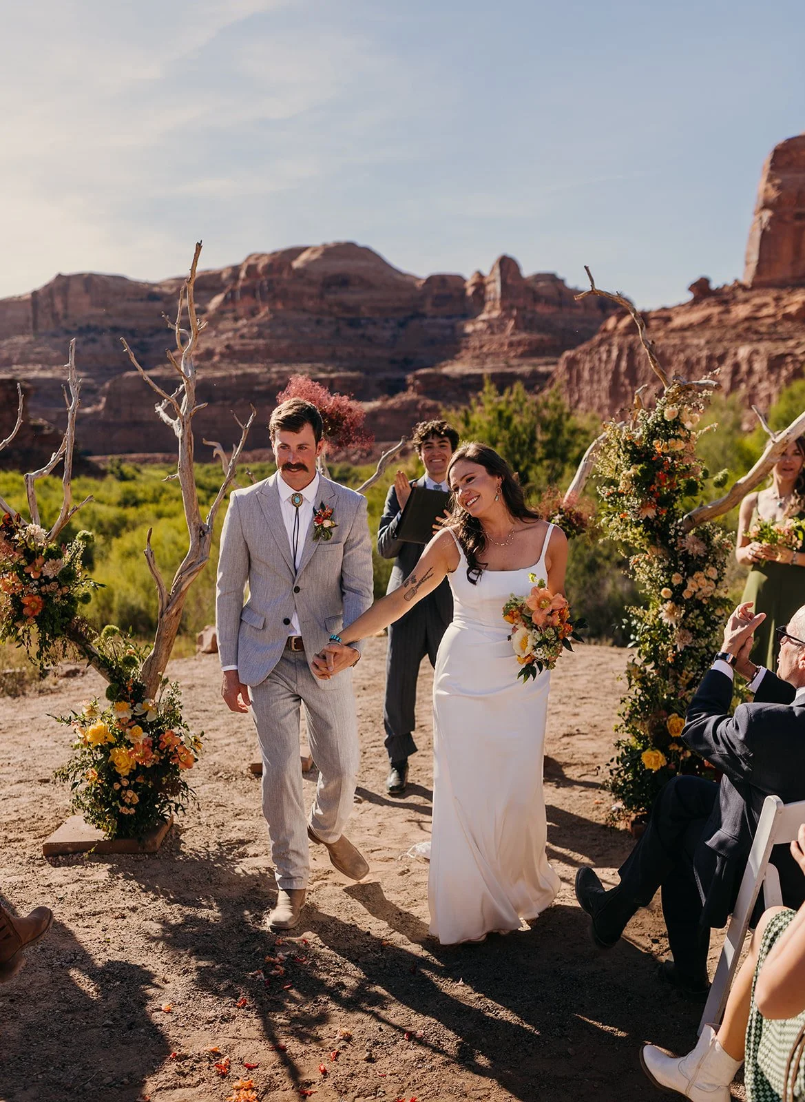 Tangled Sage couple with wedding florals