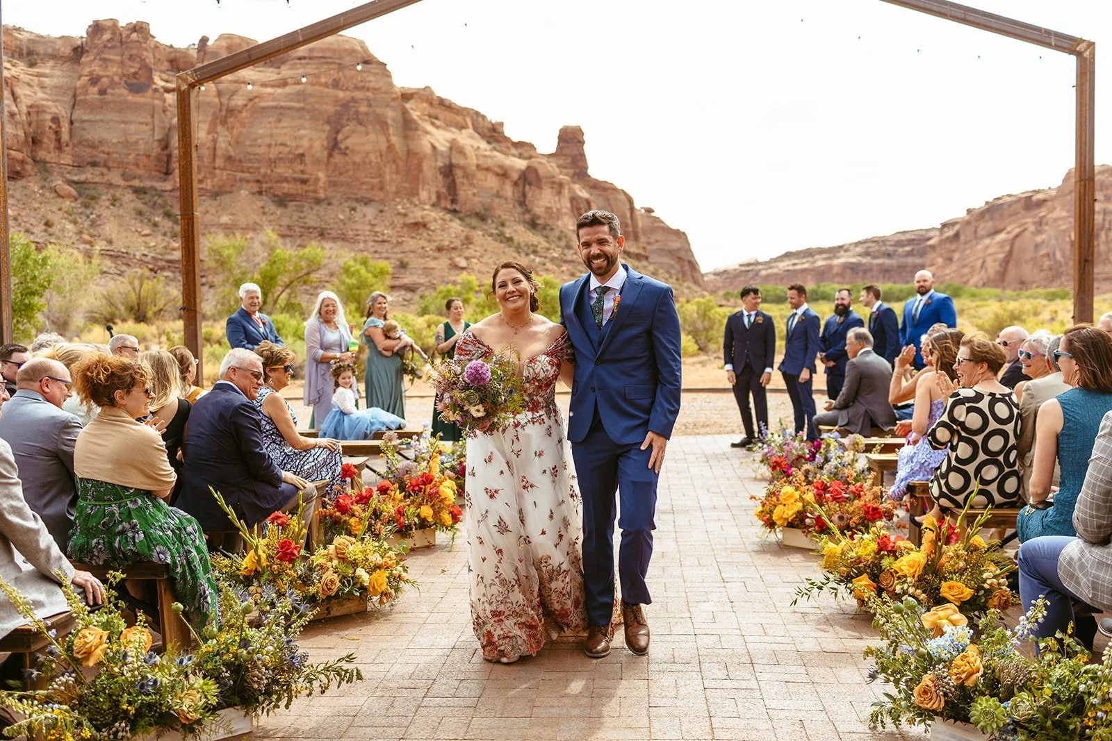 Wedding floral installation in a warm reception space