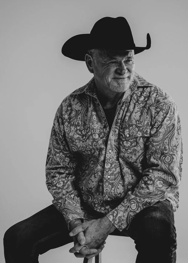 Black and white portrait of country singer-songwriter Paul Staggs photographed by JME Studios
