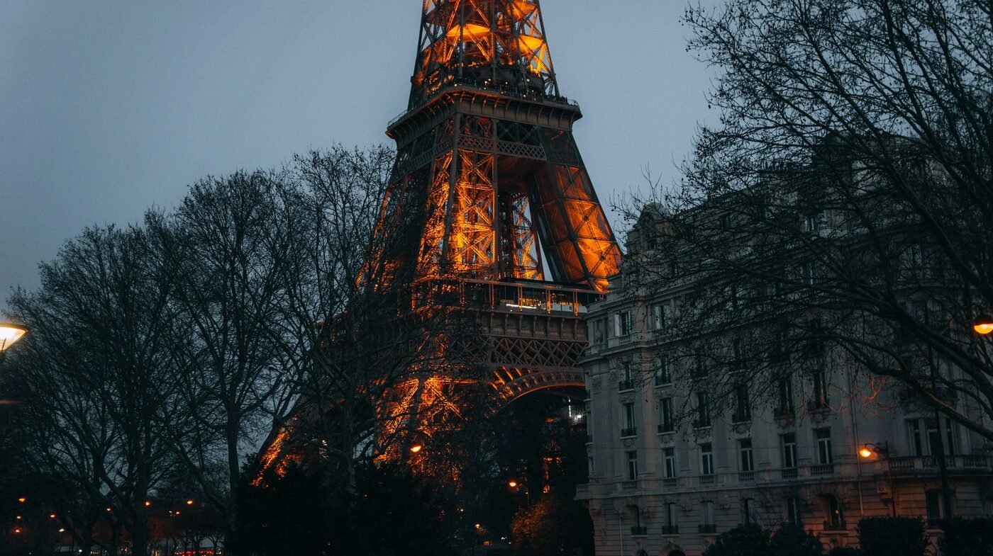 The Eiffel Tower illuminated at dusk, Paris
