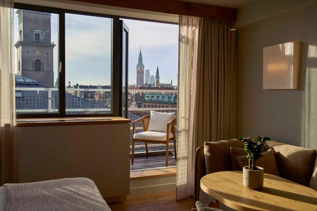 1 Hotel Copenhagen Copenhagen hotel room with private balcony overlooking City Hall clock tower and historic spires