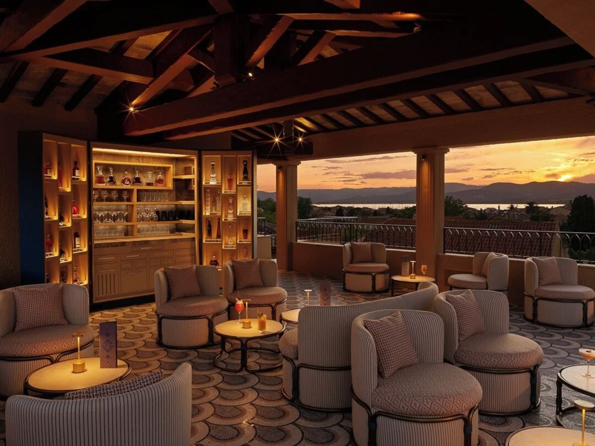 Hotel Byblos Saint-Tropez covered rooftop bar lounge at sunset with open terrace overlooking the Gulf of Saint-Tropez