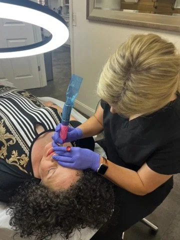 Close-up of permanent makeup application on a client during live model training session