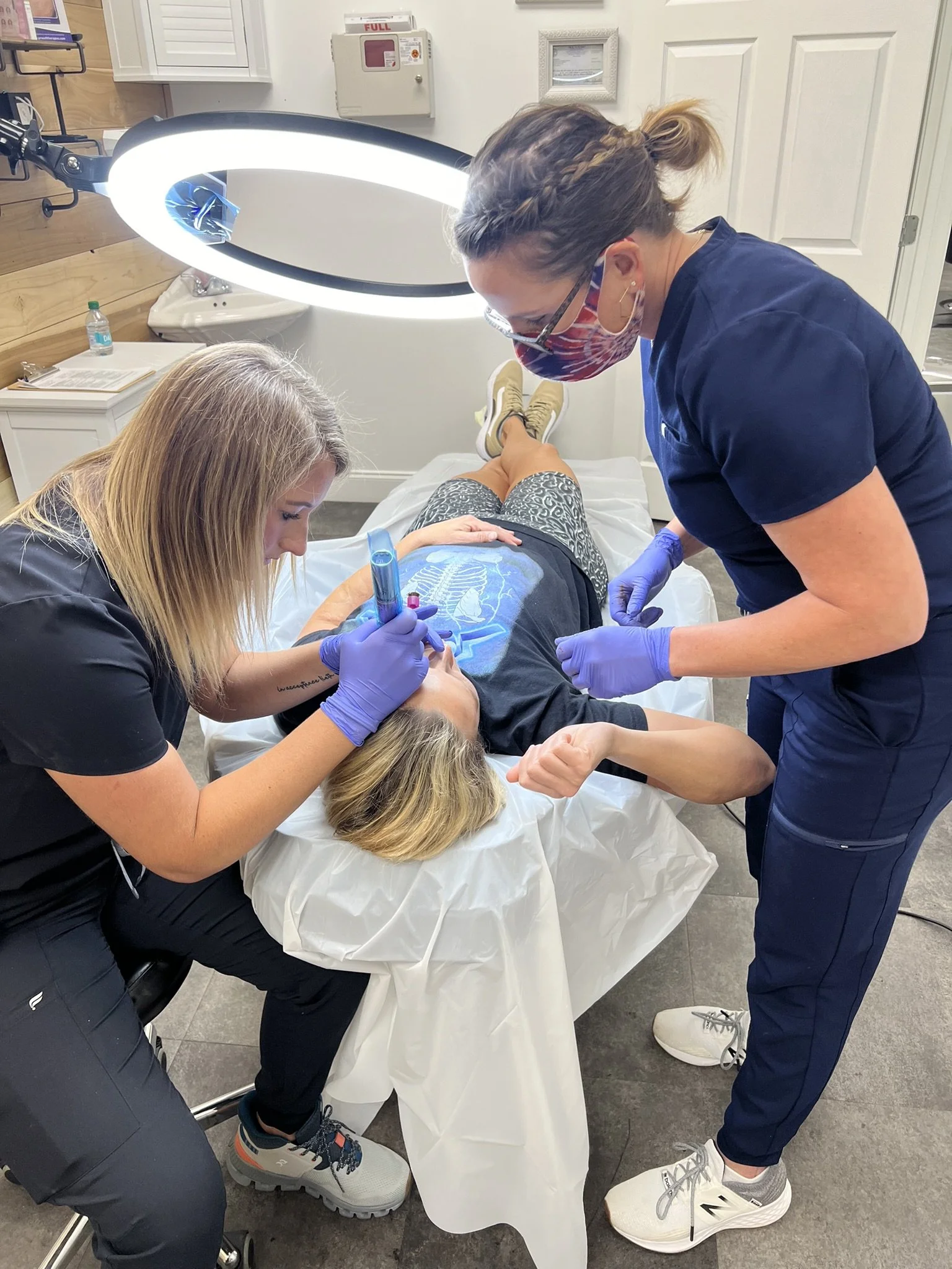 PMU certification students practicing techniques during hands-on training at Beautifully Created Ink Co.