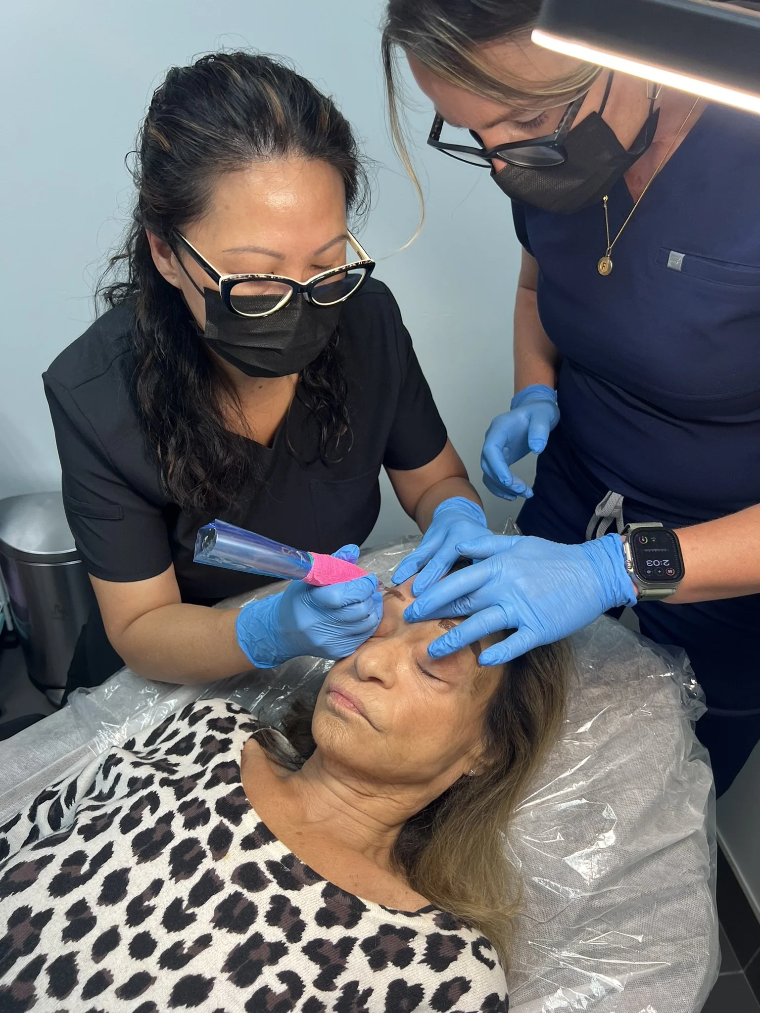 Kelly Frey performing permanent makeup on a live model during PMU certification training in Paris, TN