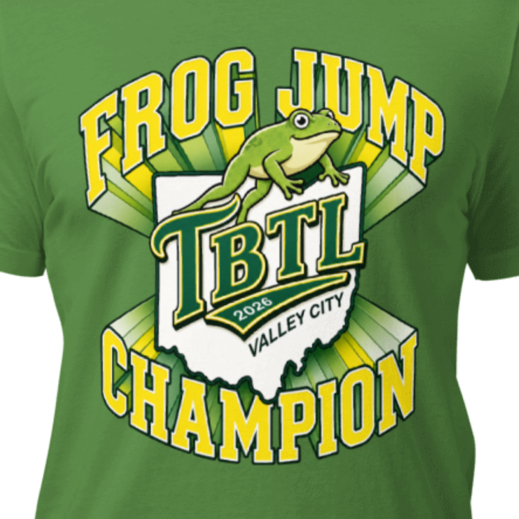 Green t-shirt that says FROG JUMP CHAMPION in big text that encircles a logo featuring the shape of Ohio with  a leaping frog and text that says TBTL 2026 Valley City
