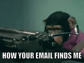 Animated gif of a monkey typing on a typewriter.  It looks like it's from a 1960s or 1970s TV show or movie, based on the film stock. 