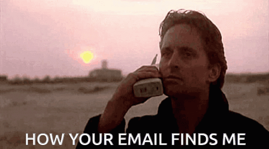 Animated GIF of Gordon Gekko from the movie Wallstreet talking on a huge cellphone on the beach with the caption: HOW YOUR EMAIL FINDS ME