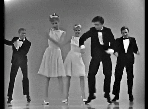 Animated GIF from the movie Simple Men of three people in their 20s or early thirties dancing strangely in a bar