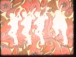 Animated gif of a sketch of a woman in a blue sweater dancing a little and clapping her hands. It's a black-and-white ink-style sketch, and only her light-blue sweater has color. 