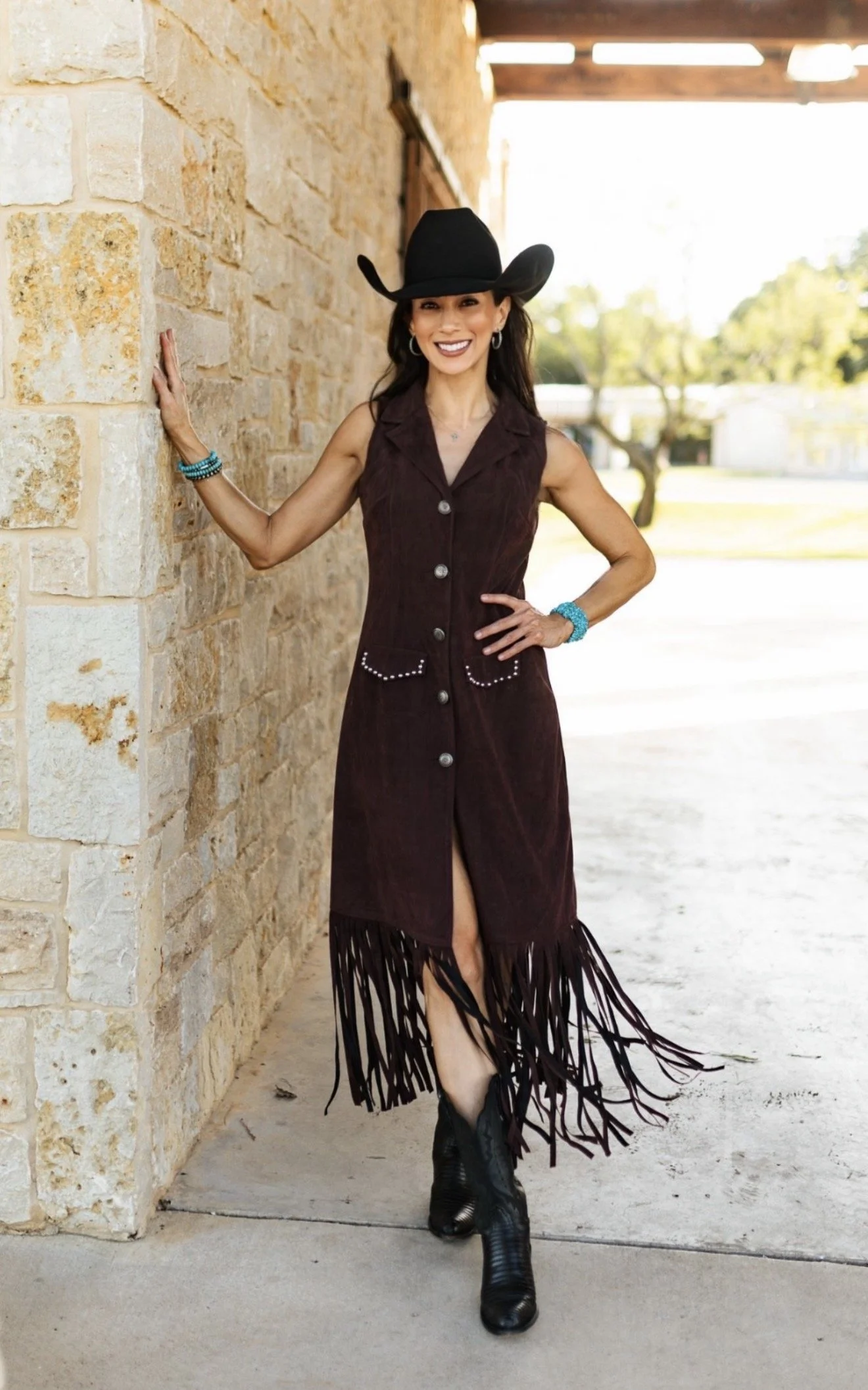 Dr. Julie Kennedy in a suede fringe dress