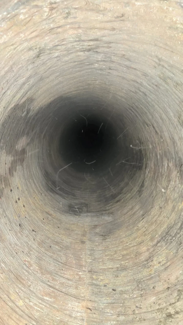 Looking straight down the heater's flue during the inspection
