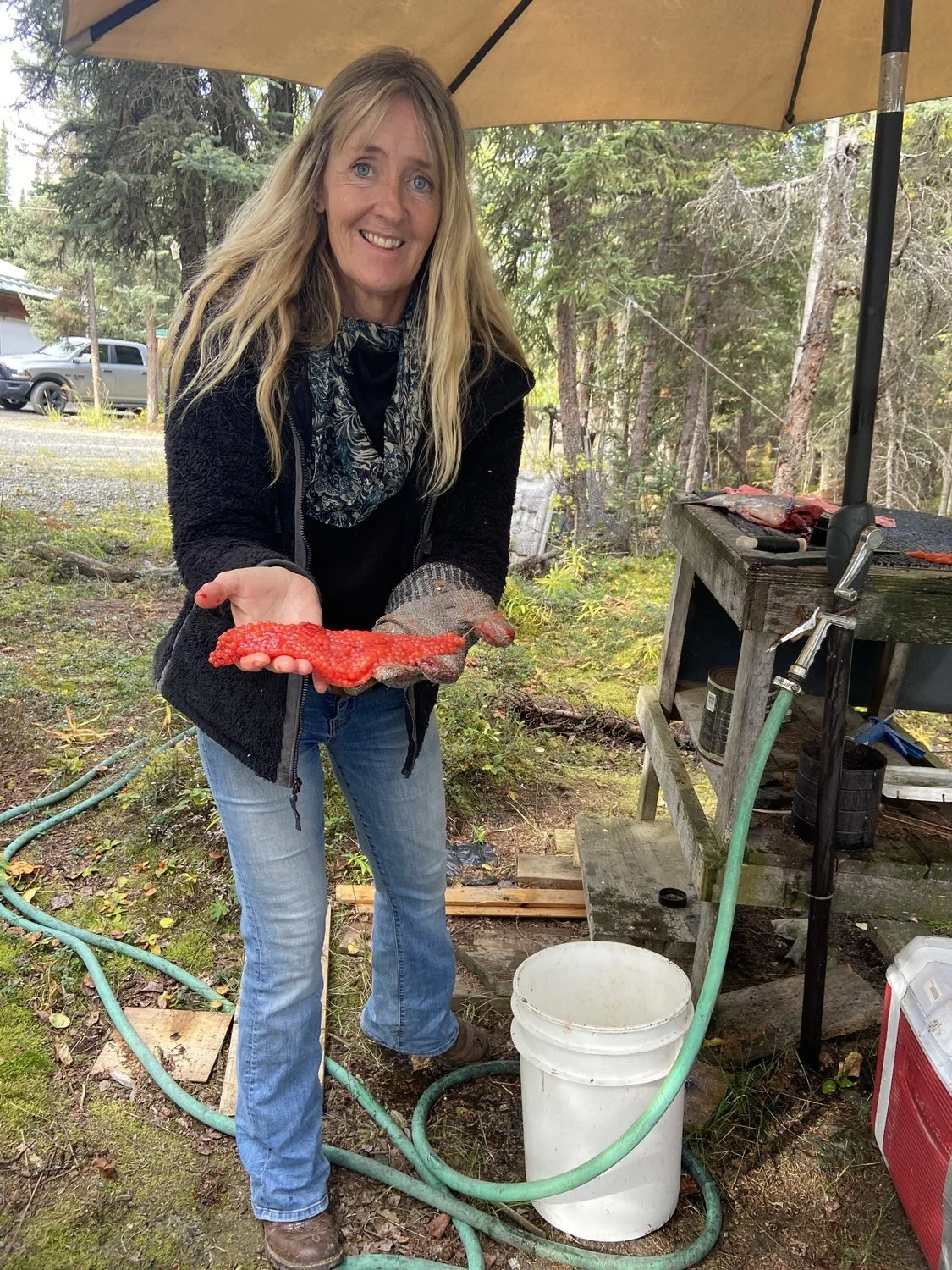 Christie Green holding a skein of salmon roe.