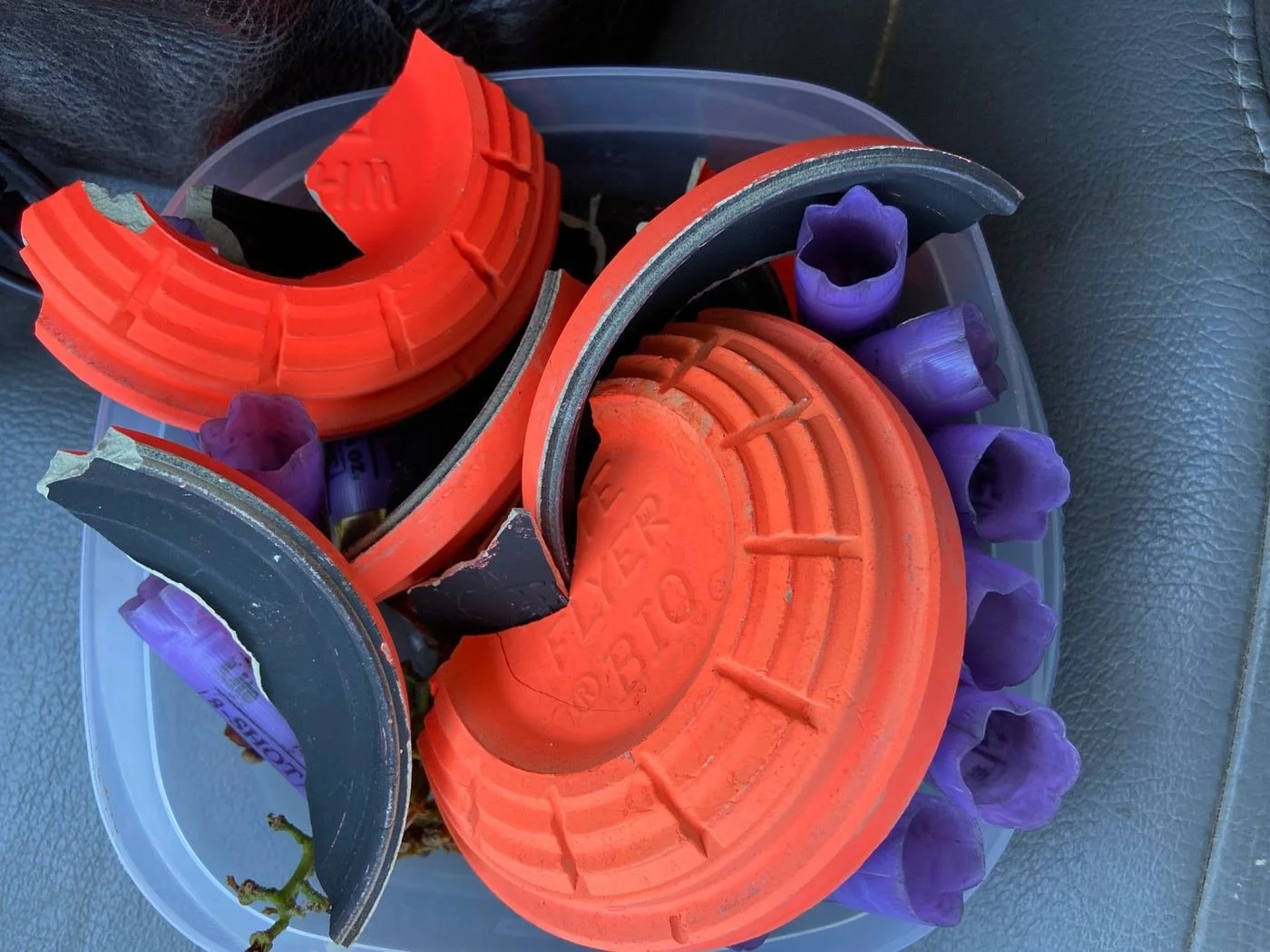 Shattered clay targets and spent shotgun shells.