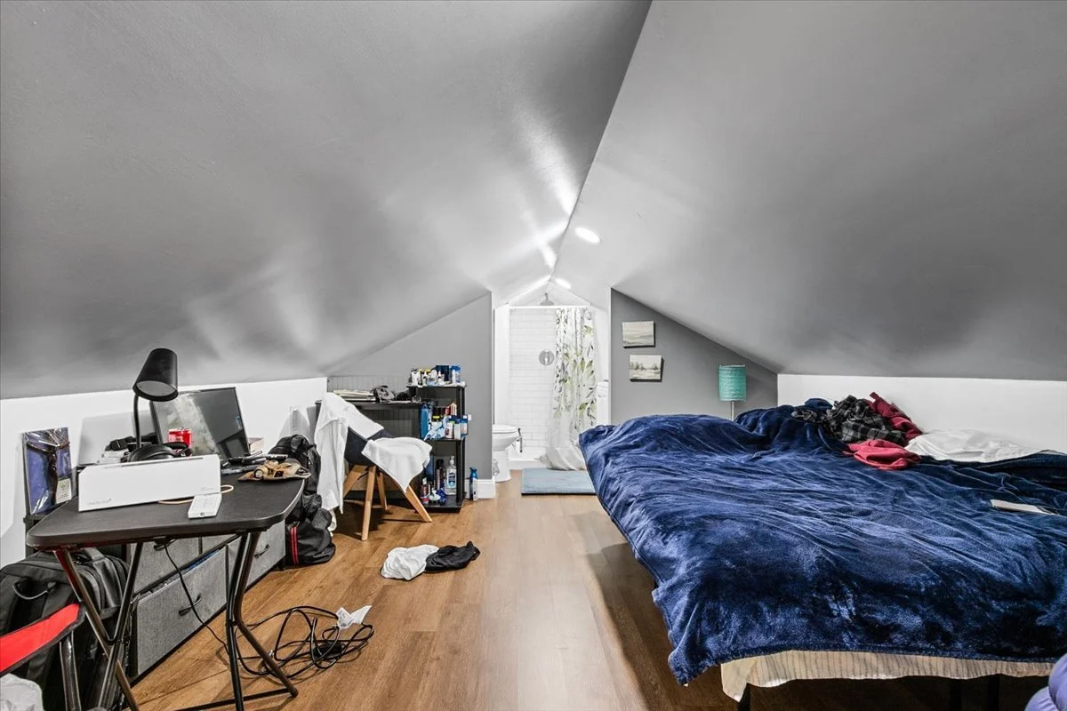Upstairs bonus room at 226 Friendly Avenue, unpermitted, ceiling under 6 ft