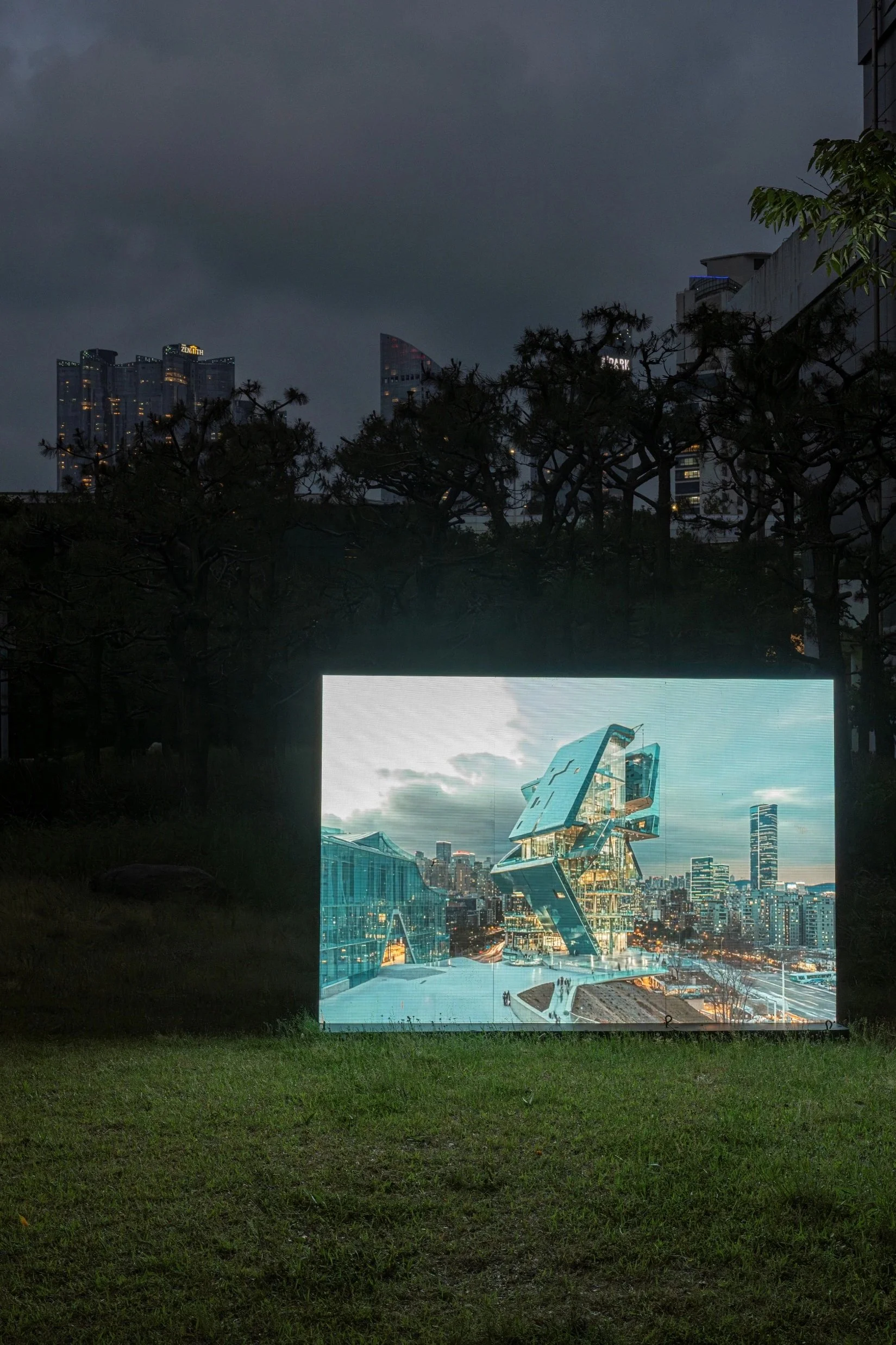 Nighttime exhibition view of Simulacra Museum