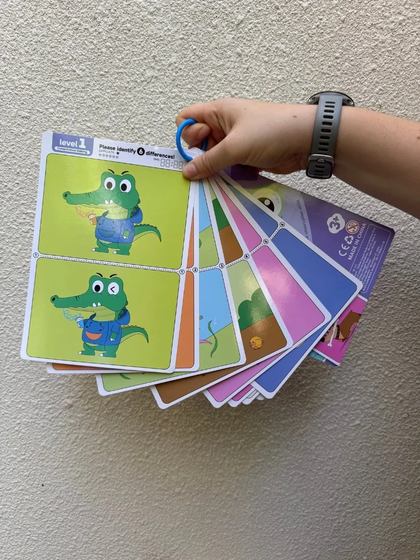 Spot-the-difference cards fanned out on their ring