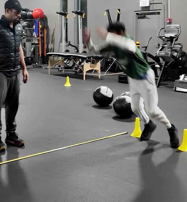 Youth athlete performing a broad jump at PerformanceGaines