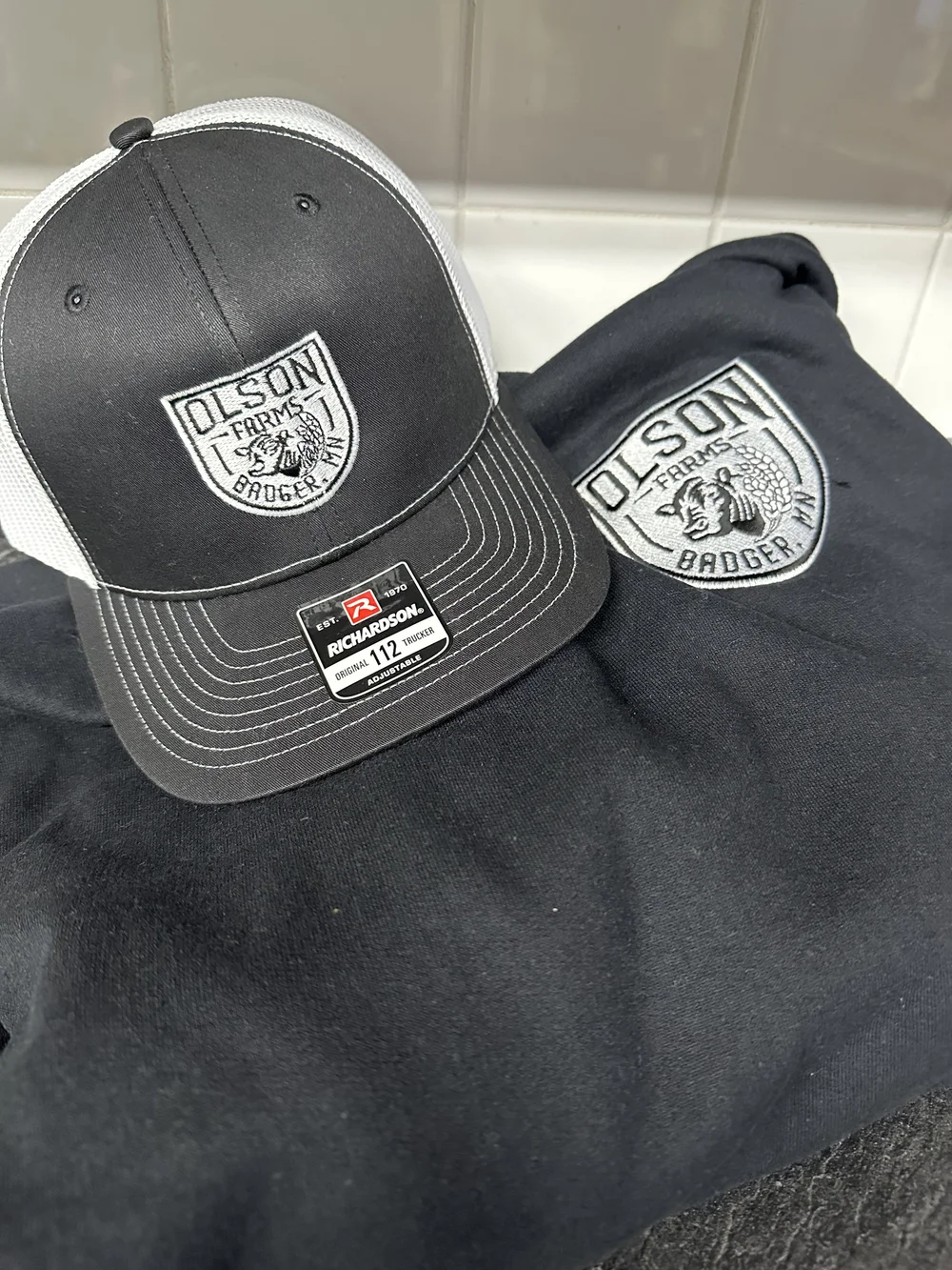 Olson Farms Badger embroidered cap and sweatshirt