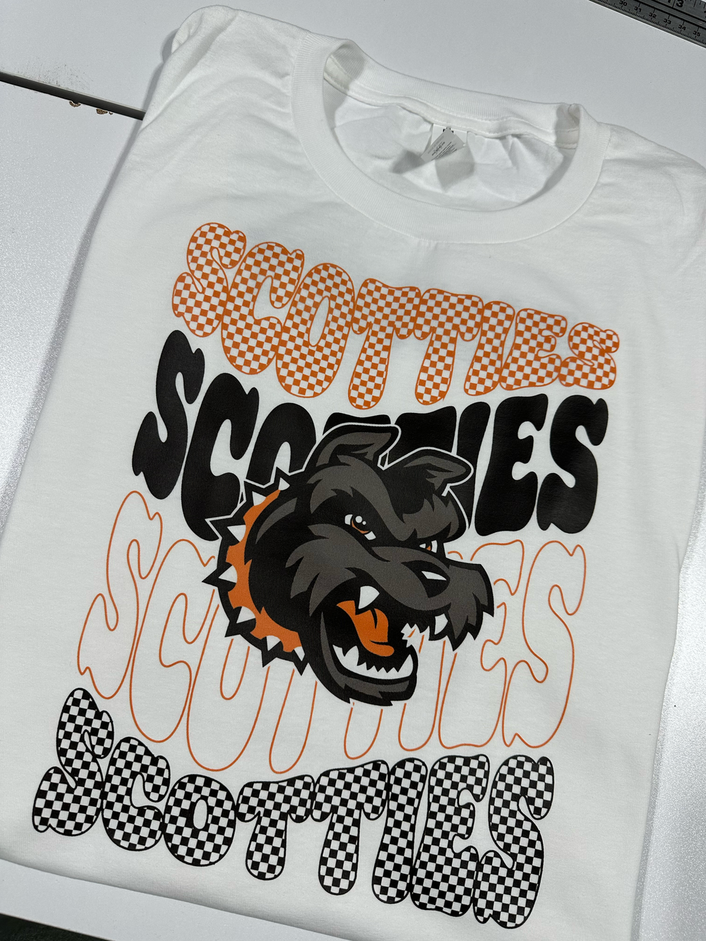 Orange-and-black school spirit T-shirt design