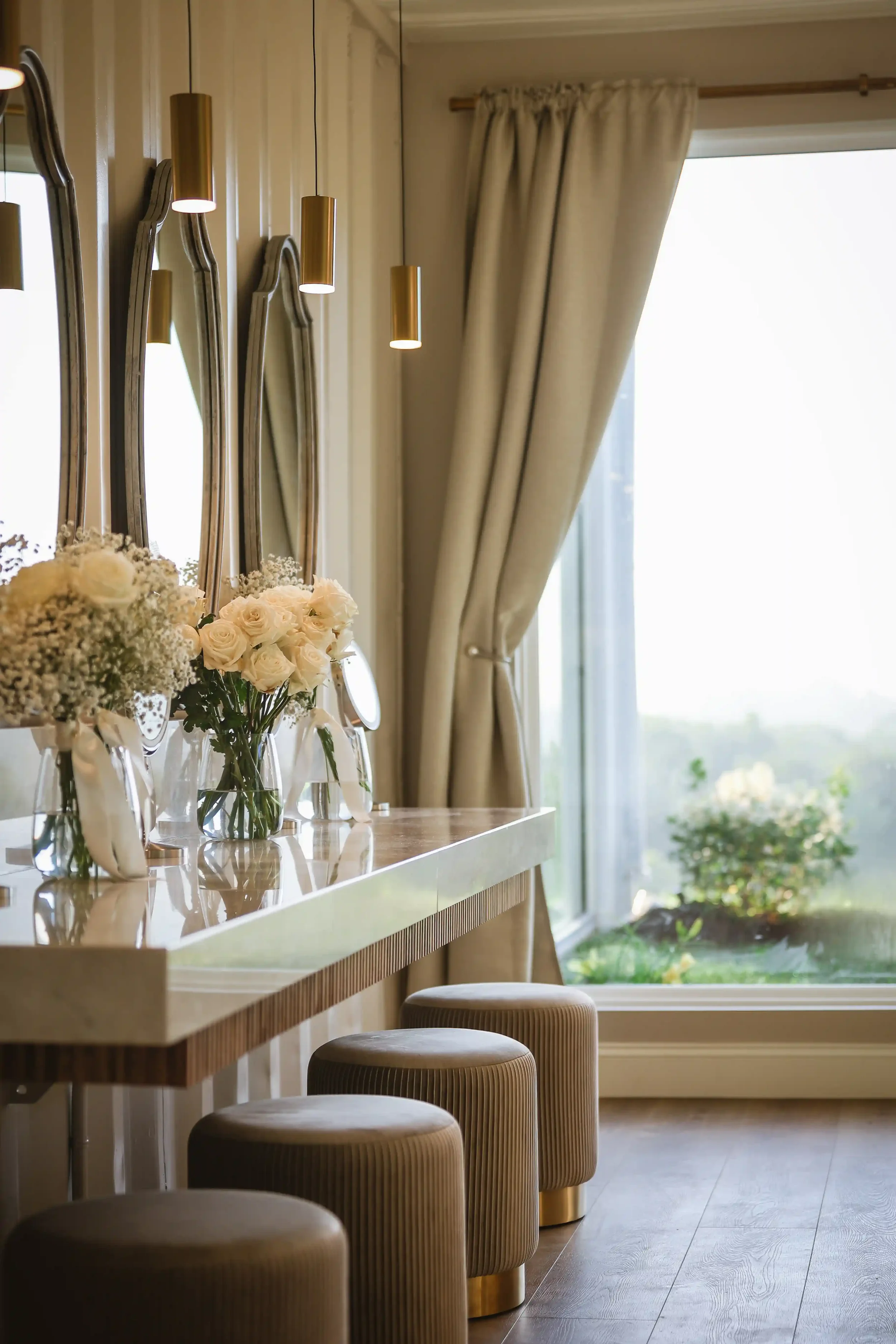Luxury bridal suite with makeup stations and scenic window views