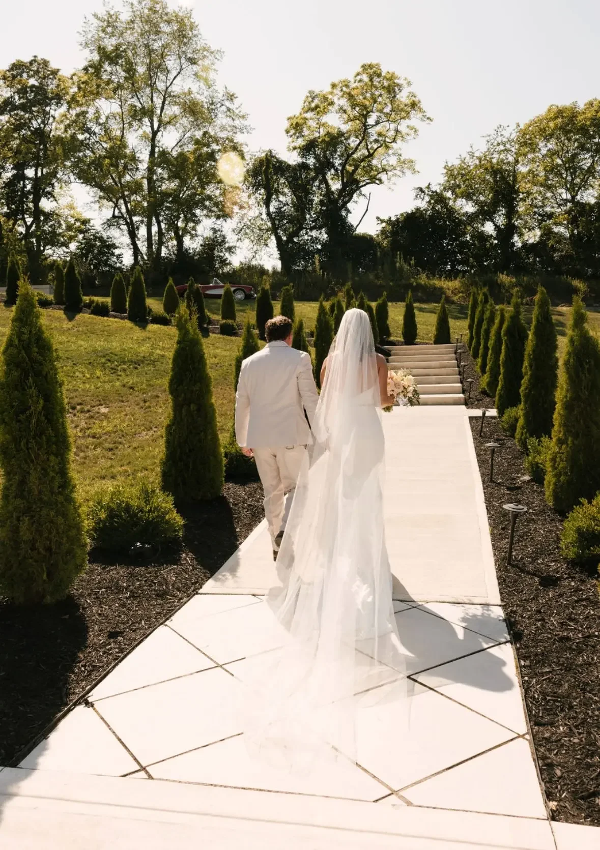 Bride and groom walking venue grounds