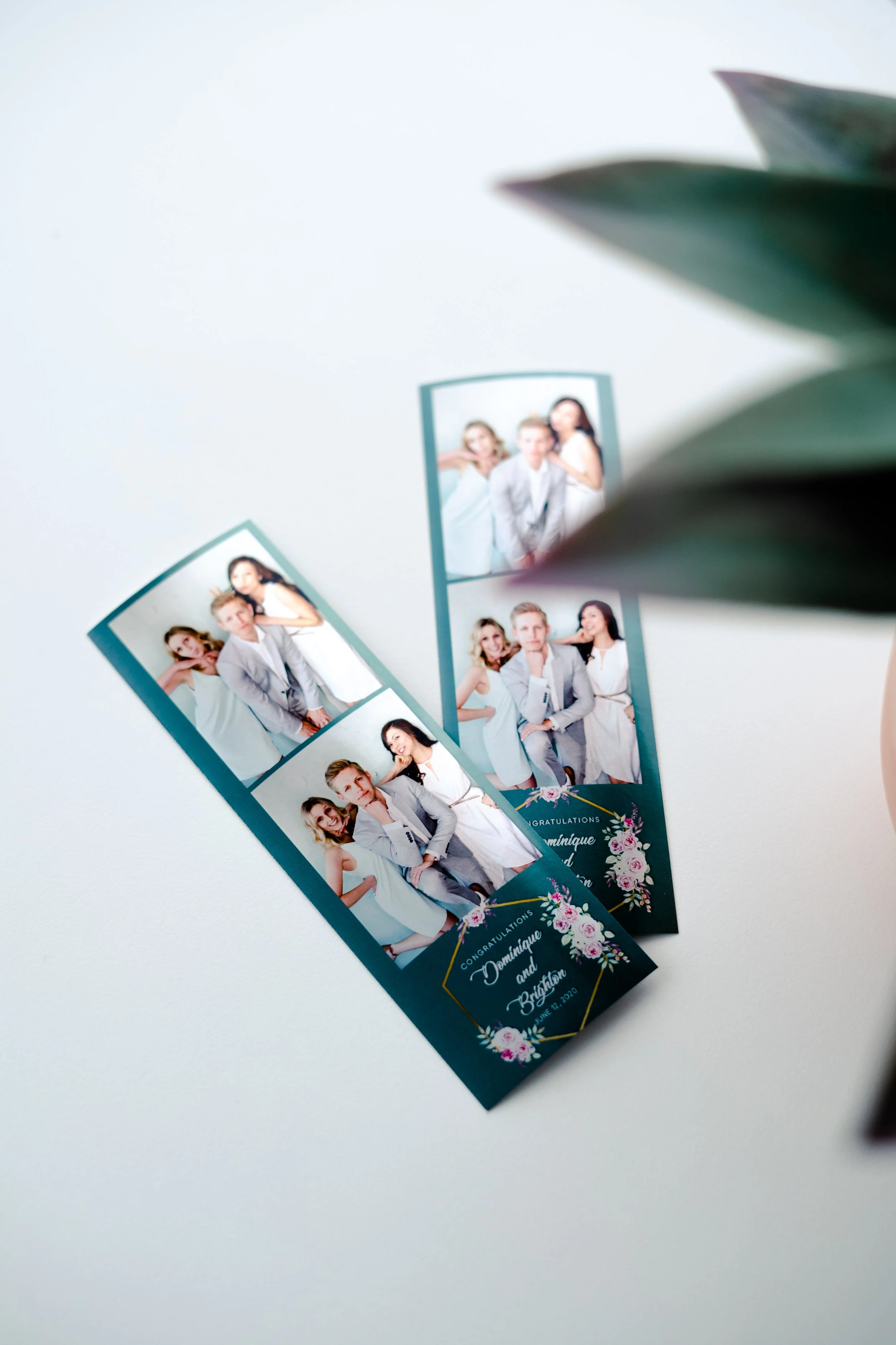 Guests holding print strips at Print Booth