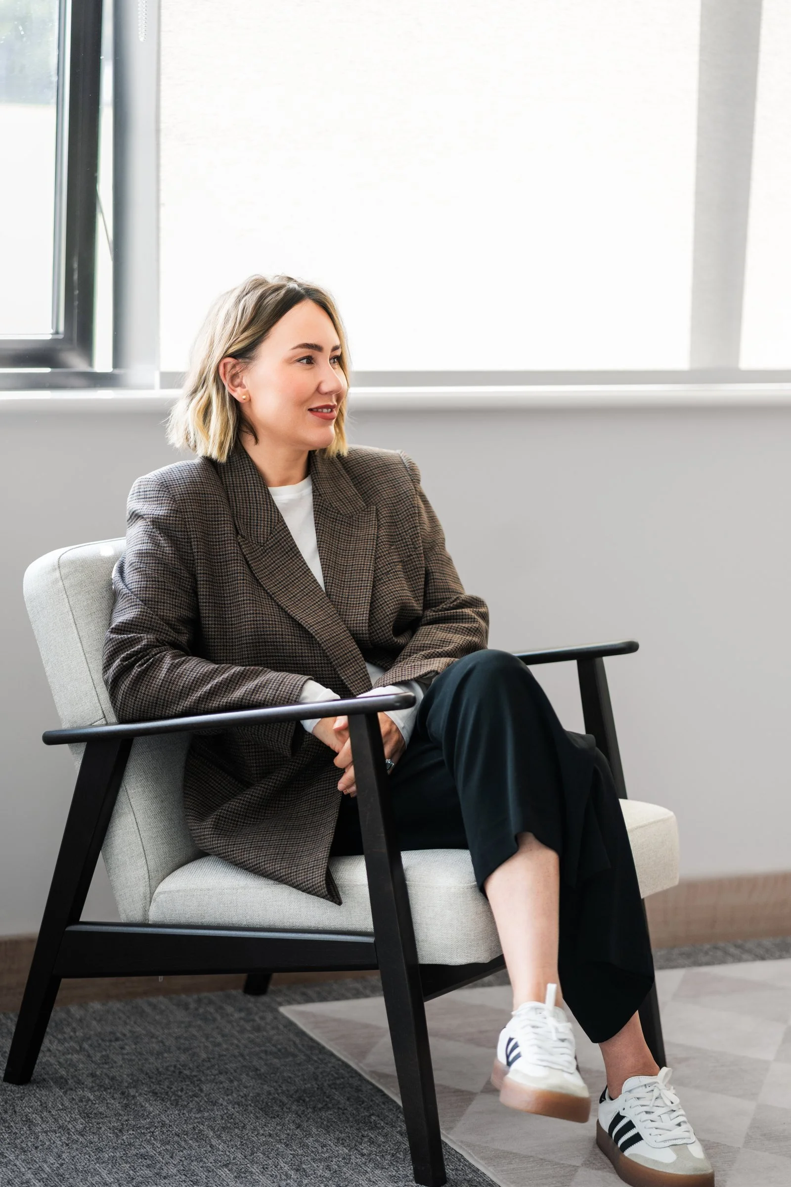 Amie Caldwell seated in the Coordinated Solutions office