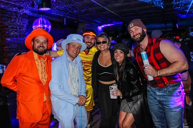 Costumed crowd at the Monster March Halloween bar crawl in Center City Philadelphia