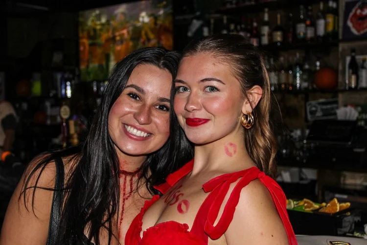 Friends in Halloween costumes at the Monster March bar crawl in Philadelphia