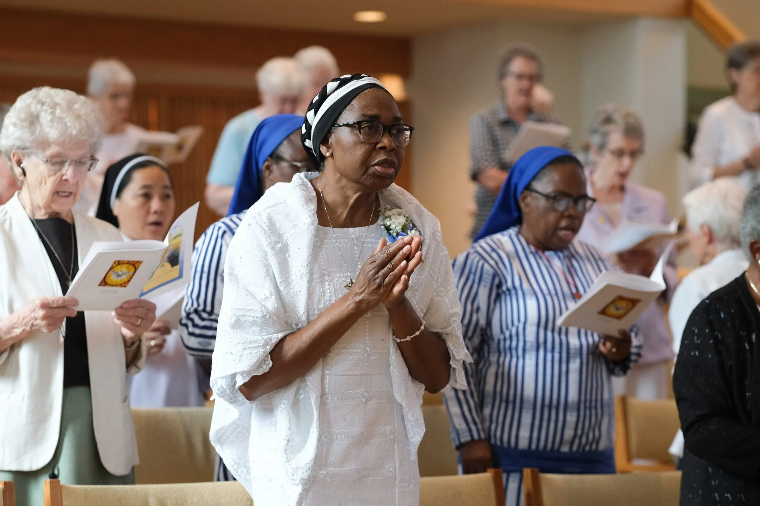 Sisters stand and pray