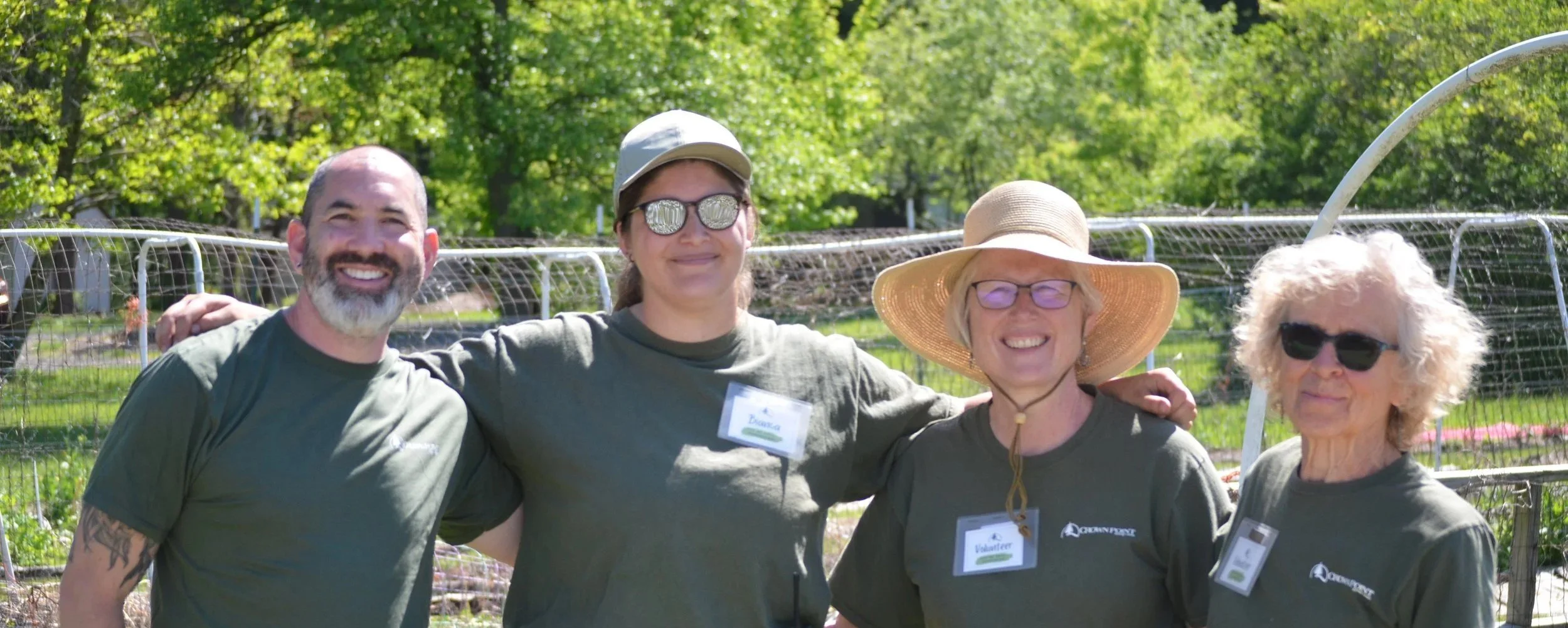 Staff and volunteers pose for photo at plant sale