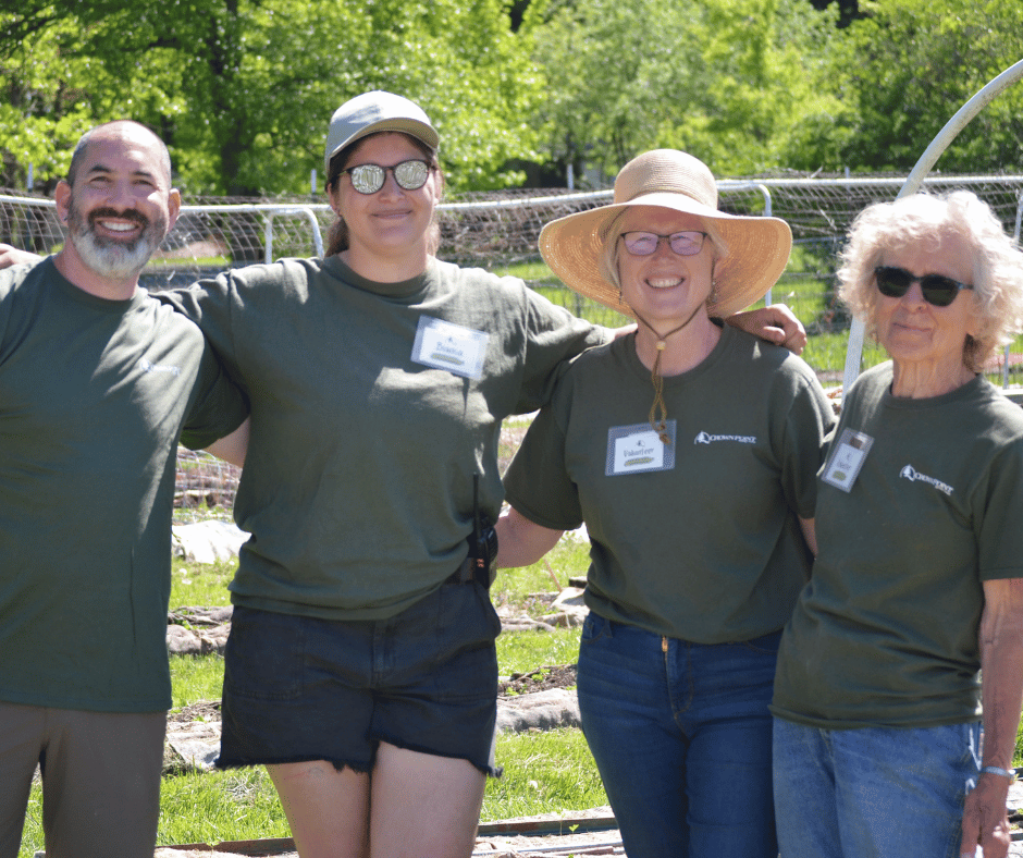 Staff and volunteers pose for photo at plant sale