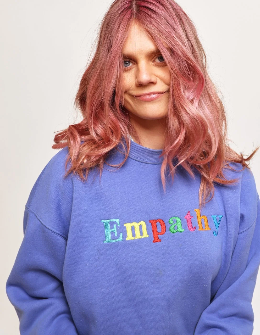 Leanne Maskell in a blue jumper that says Empathy