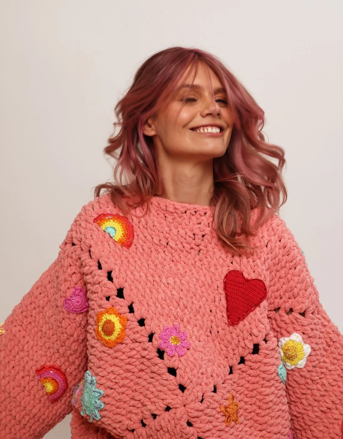 Leanne Maskell, founder of ADHD Works, smiling in a colourful knitted jumper