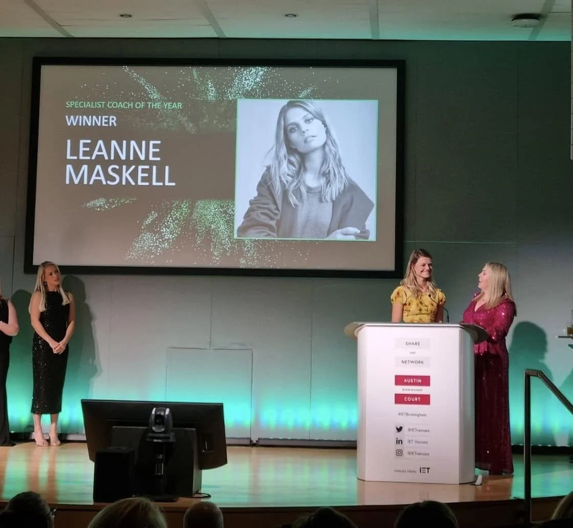 Leanne Maskell on stage as the winner of Specialist Coach of the Year