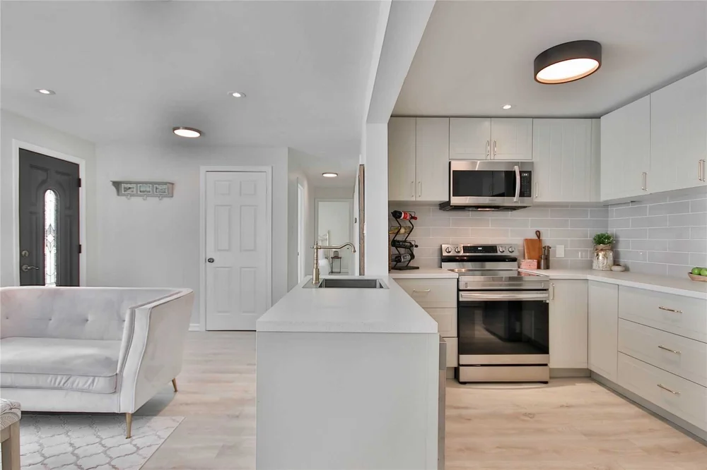Open-concept kitchen and living area after renovation